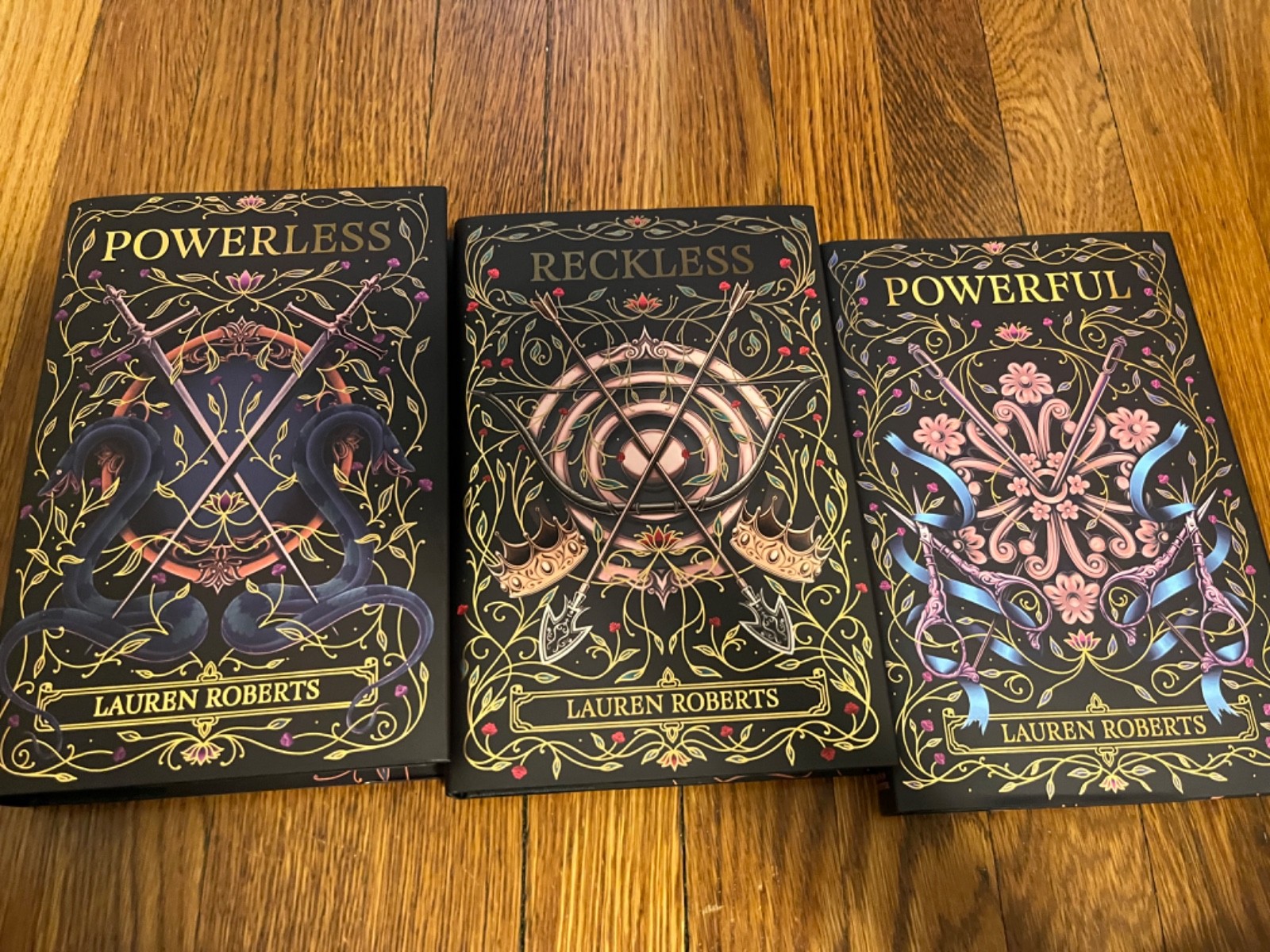 Fairyloot signed Powerless trilogy by Lauren Roberts