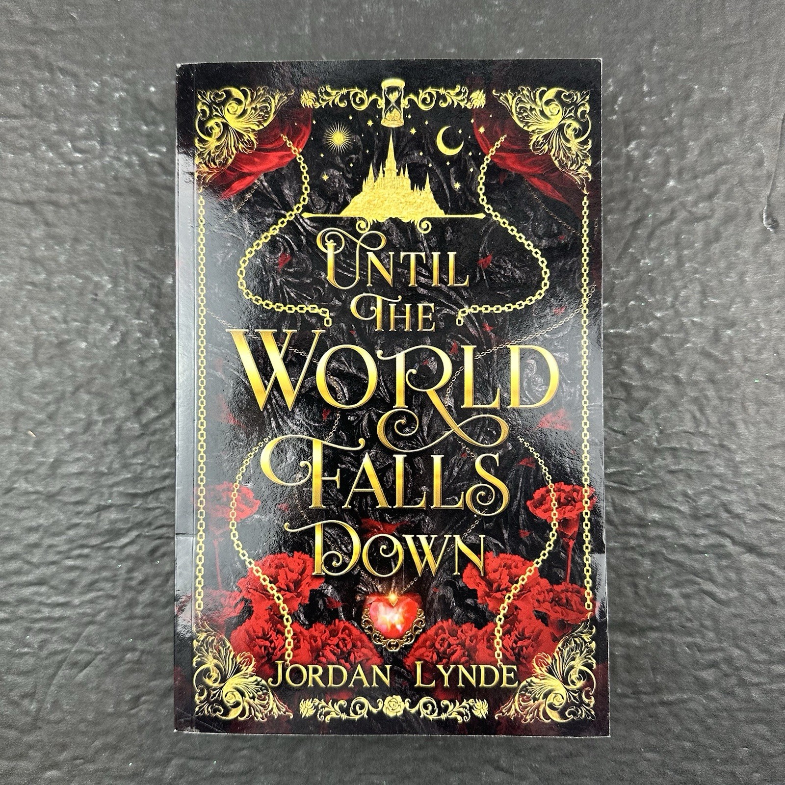 Until The World Falls Down Paperback by Jordan Lynde